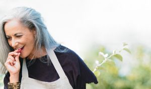 woman tasting fruit