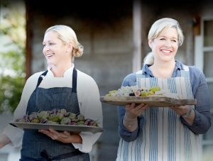 ladies carrying trays